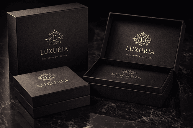 Luxury packaging design mock-up with matte black boxes and gold foil logo embossing by a packaging designer near me