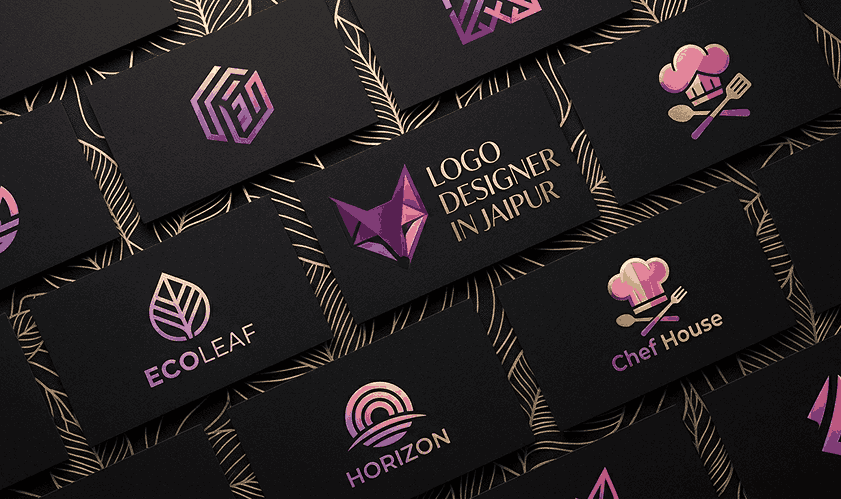 Flat vector illustration of a geometric wolf logo with the text "LOGO DESIGNER IN JAIPUR" on the left, next to a creative woman drawing with a stylus on a tablet and a desktop monitor displaying the same fox logo, all set against a layered emerald green and gold paper-cut style background with circuit patterns.